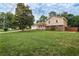 Spacious front yard with a charming two-story home and a two-car garage at 618 Nw Summerville Dr, Lawrenceville, GA 30046