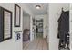 Inviting hallway with neutral tile flooring, decorative accents, and views into adjacent rooms at 618 Nw Summerville Dr, Lawrenceville, GA 30046
