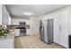 Bright kitchen features stainless steel appliances, recessed lighting, and ample counter space for efficient meal prep at 618 Nw Summerville Dr, Lawrenceville, GA 30046
