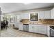 This eat-in kitchen includes stainless steel appliances and convenient access to the backyard through the back door at 618 Nw Summerville Dr, Lawrenceville, GA 30046