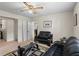 Cozy living room with neutral paint and furnishings, including a modern glass coffee table at 618 Nw Summerville Dr, Lawrenceville, GA 30046
