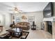 Bright living room with a cozy fireplace, plush seating, and neutral decor creating a warm ambiance at 618 Nw Summerville Dr, Lawrenceville, GA 30046