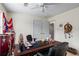 This room is well-suited for a home office, featuring a large desk, ample lighting, and a door to another room at 618 Nw Summerville Dr, Lawrenceville, GA 30046