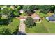 Aerial view of a home with a two-car garage, expansive yard, and mature trees at 618 Summerville Dr, Lawrenceville, GA 30046