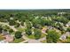 Wide aerial view of a neighborhood featuring mature trees, landscaped yards, and well-maintained streets at 618 Summerville Dr, Lawrenceville, GA 30046