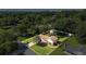 Aerial view of a well-maintained property featuring a lush green lawn, mature trees and a storage shed at 618 Summerville Dr, Lawrenceville, GA 30046