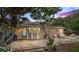 Backyard featuring a brick patio, mature trees, and outdoor seating perfect for relaxation at 618 Summerville Dr, Lawrenceville, GA 30046