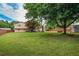 Expansive backyard with manicured lawn, privacy fence, and patio area at 618 Summerville Dr, Lawrenceville, GA 30046