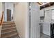 Basement stairs with laundry area featuring washer and dryer hookups and storage at 618 Summerville Dr, Lawrenceville, GA 30046