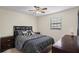 Bedroom features carpet flooring, natural light, and matching furniture with a queen size bed at 618 Summerville Dr, Lawrenceville, GA 30046