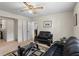 Cozy living room with neutral walls, ceiling fan, modern seating, and contemporary decor at 618 Summerville Dr, Lawrenceville, GA 30046