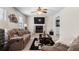 Comfortable living room featuring a fireplace, plush sofas, and ample seating at 618 Summerville Dr, Lawrenceville, GA 30046