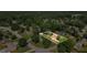 An aerial shot of a neighborhood with houses surrounded by mature trees and green lawns at 618 Summerville Dr, Lawrenceville, GA 30046