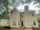 Exterior view of the house showcasing the backyard, chimney, and vinyl siding at 108 Northcutt Station Pl, Acworth, GA 30101