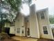 Exterior view of home featuring backyard patio, chimney, and vinyl siding at 108 Northcutt Station Pl, Acworth, GA 30101