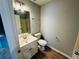 Bathroom with stylish wood-look flooring, sink vanity, and toilet at 108 Northcutt Station Pl, Acworth, GA 30101