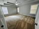 Large bedroom with a tray ceiling, recessed lighting, and lots of natural light from the large windows at 108 Northcutt Station Pl, Acworth, GA 30101