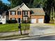 Charming two-story brick home with a well-manicured lawn and two car garage at 108 Northcutt Station Pl, Acworth, GA 30101