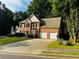 Lovely two-story home with a brick facade, black shutters, and an attached two car garage at 108 Northcutt Station Pl, Acworth, GA 30101