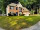 Attractive brick two-story home with an attached two-car garage and a landscaped front yard at 108 Northcutt Station Pl, Acworth, GA 30101