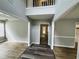 Open foyer showcasing wood-look flooring and natural light with a view to the second story at 108 Northcutt Station Pl, Acworth, GA 30101