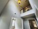 A light-filled foyer with hardwood floors and a view of the second-floor balcony at 108 Northcutt Station Pl, Acworth, GA 30101