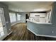 Modern kitchen with white cabinets, stainless steel appliances, and hardwood floors, eat in area at 108 Northcutt Station Pl, Acworth, GA 30101