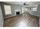 Spacious living area with a fireplace, hardwood floors, and seamless flow to the kitchen at 108 Northcutt Station Pl, Acworth, GA 30101