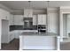 Modern kitchen with white cabinets, an island, and stainless steel appliances at 199 Vinca Nw Cir, Kennesaw, GA 30144