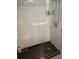 Modern bathroom with a glass-enclosed shower, white tile, and sleek fixtures at 2493 Springdale Rd, Atlanta, GA 30315