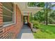 Cozy front porch with brick accents and space for outdoor decor at 2493 Springdale Rd, Atlanta, GA 30315
