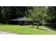Charming single-story brick home with a well-manicured lawn and mature trees at 2493 Springdale Rd, Atlanta, GA 30315