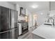 Modern kitchen with stainless steel appliances and white cabinetry at 2493 Springdale Rd, Atlanta, GA 30315