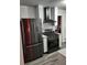 Modern kitchen features stainless steel appliances including a refrigerator, and stove at 2493 Springdale Rd, Atlanta, GA 30315