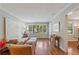 Bright living room boasts hardwood floors, large windows, and ample seating at 2493 Springdale Rd, Atlanta, GA 30315