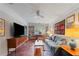 Inviting living room with a comfortable gray sofa, mid-century cabinet, and unique decor at 2493 Springdale Rd, Atlanta, GA 30315