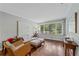 Bright living room featuring hardwood floors, a large window, and neutral decor at 2493 Springdale Rd, Atlanta, GA 30315