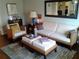 Cozy living room with wicker furniture, neutral color palette, and stylish area rug at 2493 Springdale Rd, Atlanta, GA 30315
