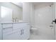 Bathroom with a white vanity, toilet, and a shower-tub combo with white subway tile surround at 512 Winston Croft Cir # 56, Johns Creek, GA 30022