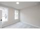 Bedroom featuring carpeted floor, two windows, and neutral paint at 512 Winston Croft Cir # 56, Johns Creek, GA 30022