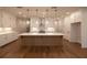 Modern kitchen with white cabinets, stainless steel appliances, and hardwood floors at 512 Winston Croft Cir # 56, Johns Creek, GA 30022