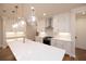 Stylish kitchen with white cabinets, stone countertops, stainless steel appliances, and hardwood floors at 512 Winston Croft Cir # 56, Johns Creek, GA 30022