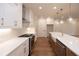 Modern kitchen with white cabinets, stainless steel appliances, and hardwood floors at 512 Winston Croft Cir # 56, Johns Creek, GA 30022