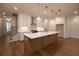 Kitchen featuring an island, hardwood floors, and white countertops at 512 Winston Croft Cir # 56, Johns Creek, GA 30022