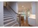 Staircase view towards a spacious living room and kitchen at 512 Winston Croft Cir # 56, Johns Creek, GA 30022