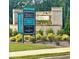 Welcoming entrance to the community featuring stone accents, professional landscaping and the 'Energy Star Certified' banner at 512 Winston Croft Cir # 57, Johns Creek, GA 30022