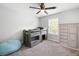 Comfortable bedroom with bunk beds, storage, neutral carpet, and large window with backyard view at 1016 Buckeye Ln, Villa Rica, GA 30180