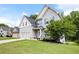 Charming two-story home with a well-maintained lawn and a three car garage at 1016 Buckeye Ln, Villa Rica, GA 30180