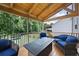 Covered deck with comfortable seating, great for outdoor relaxation and entertaining at 1016 Buckeye Ln, Villa Rica, GA 30180