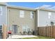 View of back of home and patio area with a grill and chairs at 11730 Chatham Dr, Hampton, GA 30228